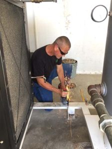 Working on a jobsite Air Compressor install